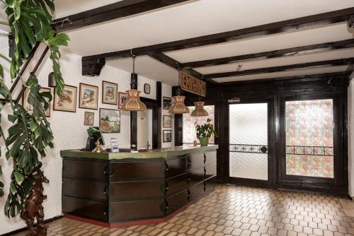 a kitchen with a dresser in a room at Hotel-Restaurant Johanniskreuz in Trippstadt