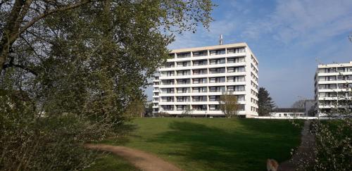 a large white building with a green lawn in front of it at FeWo "Zitadelle" in Kellenhusen/Ostsee in Kellenhusen