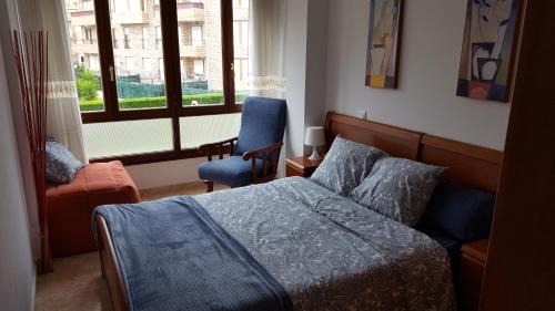 Ένα ή περισσότερα κρεβάτια σε δωμάτιο στο Apartamento Turístico Los Altos