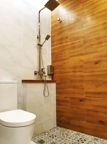 a bathroom with a toilet and a shower at Mahkota Seaview Condo Homestay Near A'Famosa jonker Melaka in Melaka
