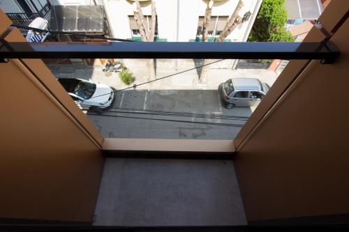 a view from a window of a parking lot with cars at BOUTIQUE 25h by Eva stay 018 in Niš