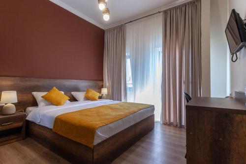 Postel nebo postele na pokoji v ubytování Hotel Avenue 106