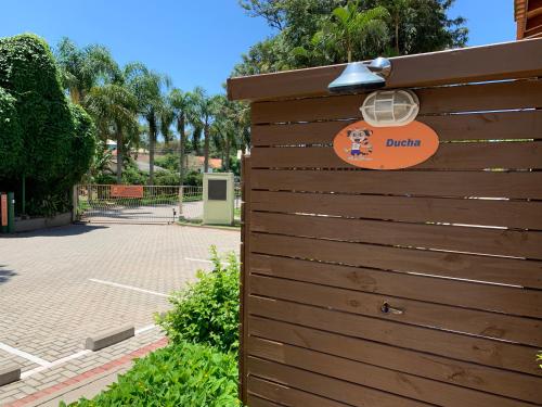 a wooden fence with a sign on it at Hotel São Sebastião da Praia in Florianópolis