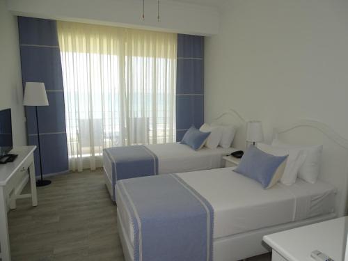 Katil atau katil-katil dalam bilik di Marvel Tree Hotel