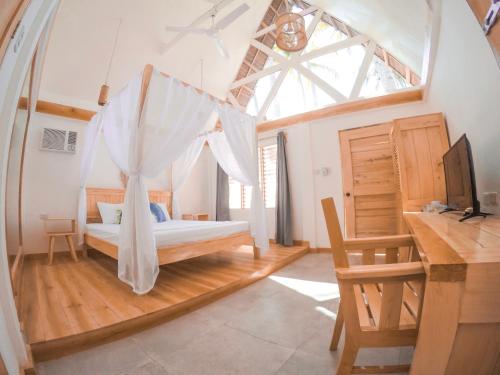 Postel nebo postele na pokoji v ubytování Bermuda Triangle Bungalows