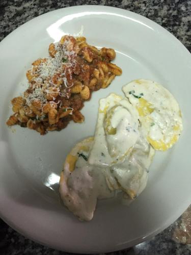 a plate of food with meat and eggs on a table at hotel lo sciatore in Cotronei