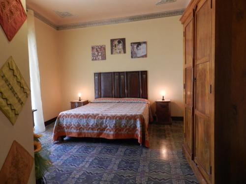 Ein Bett oder Betten in einem Zimmer der Unterkunft Antico Palazzo Affitti brevi