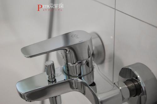 a bathroom sink with a faucet in front of a mirror at Comfort Apartment Oldenburg in Oldenburg