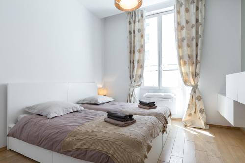 Cama ou camas em um quarto em Le St Honoré