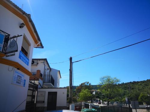 a view of a building with a hill in the background at Pensión Venta Julián HCA01134 in El Bosque