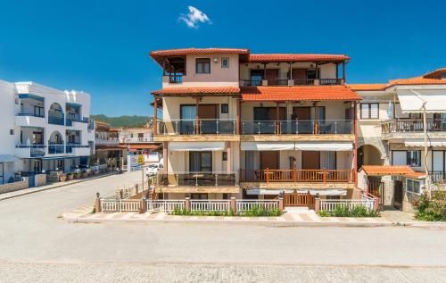 a building on the side of a street at House Kostas on the beach in Sarti