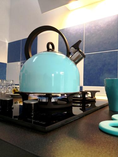 a pot sitting on top of a stove in a kitchen at Framavi Beach in Cefalù