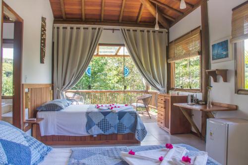 A bed or beds in a room at Linda casa em Itacaré Bahia