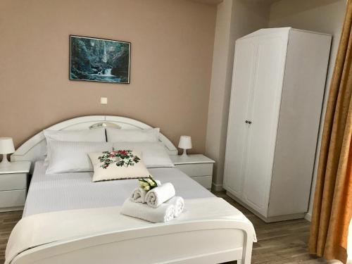 Postel nebo postele na pokoji v ubytování Joy Hotel