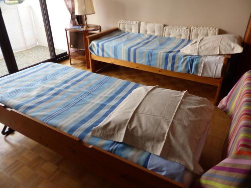 Un ou plusieurs lits dans un hébergement de l'établissement Résidence Rose Mousse