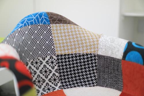 a close up of a quilt on a couch at Bed Nonnonino in Porto Cesareo