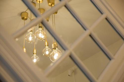 a chandelier in a room with a window at City Hotell Avenyn in Gothenburg