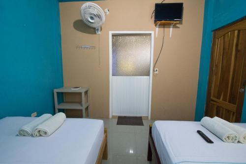 Hostal Alcazabaにあるベッド