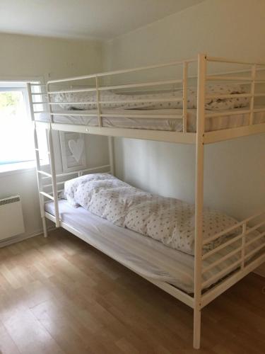 a bedroom with two bunk beds in a room at Hällestrand Apartment 32 in Strömstad