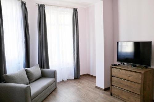 Телевизор и/или развлекательный центр в Apartments Moravská 24