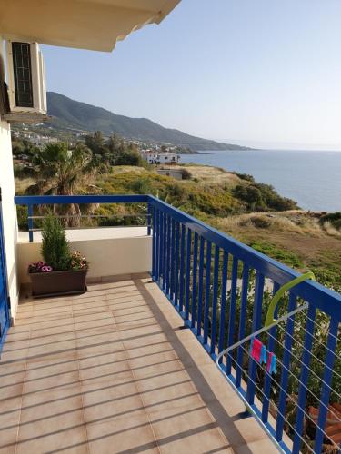 a balcony with a view of the ocean at Kanalli Apartments in Pomos
