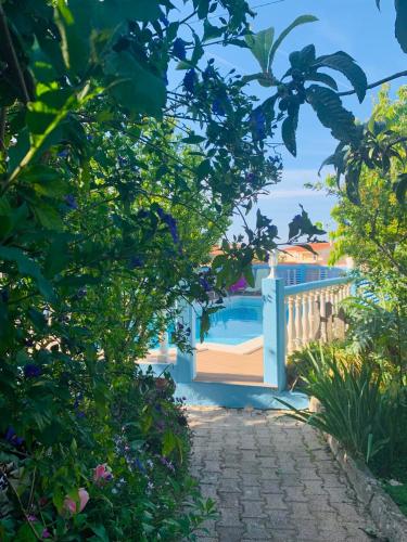a view of a swimming pool through the trees at Fatima Belavista & Pool in Fátima