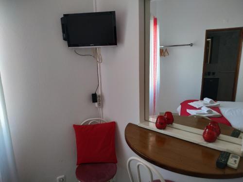 TV o dispositivi per l'intrattenimento presso AL "Hospedaria Por do sol" Sunset Olhao