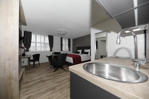 Kuchyň nebo kuchyňský kout v ubytování Business Apartments Reichenburg