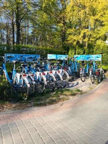a bunch of bikes parked next to each other at AQUAMARINA ONYX GOLD in Międzyzdroje