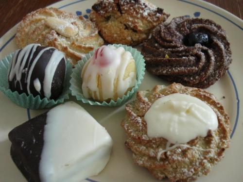 a plate of different types of donuts on a table at Breezes B&B in Conca Specchiulla