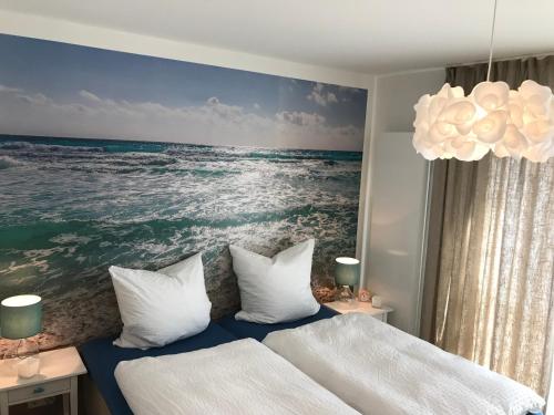 Postel nebo postele na pokoji v ubytování SEASIDE APARTMENTS - BEACHHOUSE WAVE