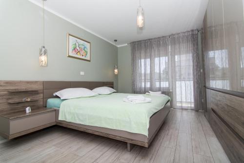 Posteľ alebo postele v izbe v ubytovaní apartman Marin