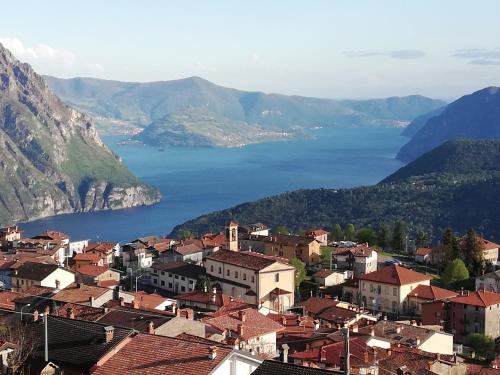 a view of a town with a body of water at Home Iseo Lake in Bossico