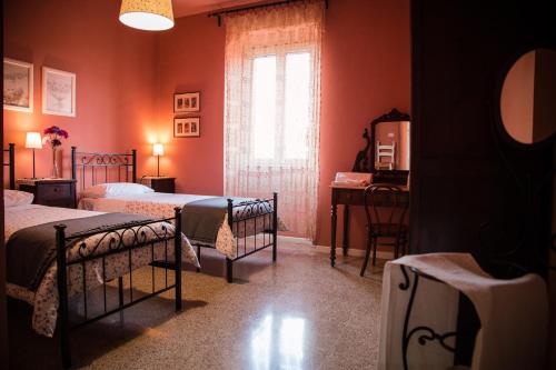 Postel nebo postele na pokoji v ubytování B&B I Due Gelsi