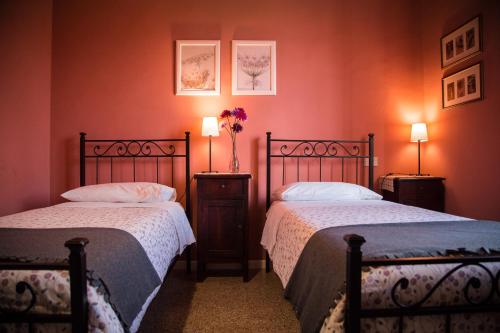 Postel nebo postele na pokoji v ubytování B&B I Due Gelsi