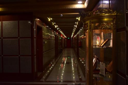 a long hallway with lights in a building at Canary Beach Hotel in Yanbu