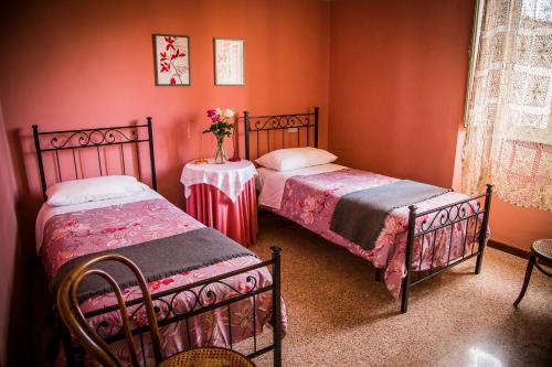 Postel nebo postele na pokoji v ubytování B&B I Due Gelsi