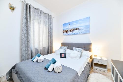 Posteľ alebo postele v izbe v ubytovaní Serenity Apartment