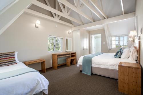 Ένα ή περισσότερα κρεβάτια σε δωμάτιο στο Quainton Cottages