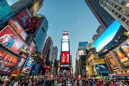a view of a busy city with people and billboards at Hyatt Herald Square New York in New York