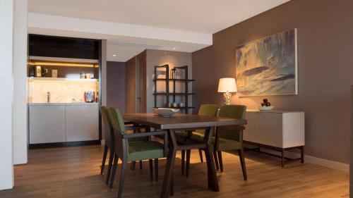 a dining room with a table and chairs at Hyatt Centric Montevideo in Montevideo