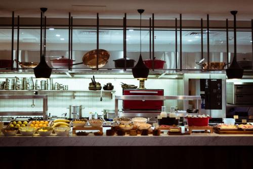 a kitchen with a bunch of food on a counter at Hyatt Centric Montevideo in Montevideo
