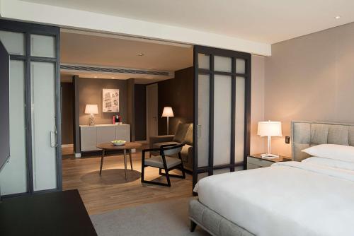 a hotel room with a bed and a desk at Hyatt Centric Montevideo in Montevideo