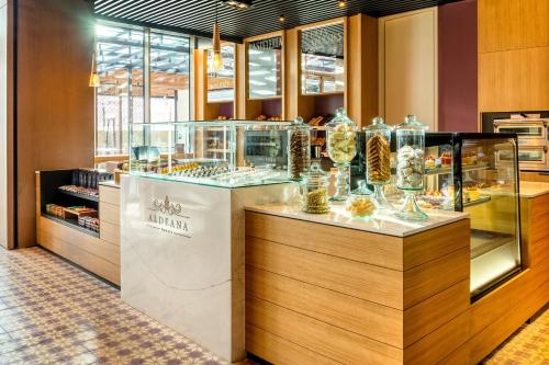 a display case in a store with a lot of glasses at Grand Hyatt Bogota in Bogotá