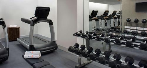 a gym with a row of tread machines at Hyatt Herald Square New York in New York