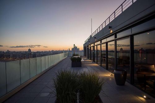 a balcony of a building with a view of a city at Hyatt Centric Montevideo in Montevideo