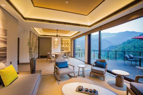 a living room with a view of a mountain at AHN LAN Ninghai in Ninghai