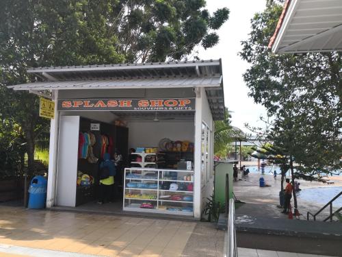a small shop on the side of a street at Bayou Lagoon Park Resort in Melaka