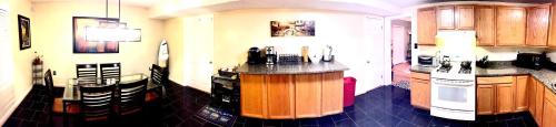 a kitchen with a island in the middle of a room at The Haven at Charity House in Waldorf