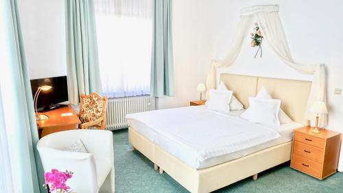 Ένα ή περισσότερα κρεβάτια σε δωμάτιο στο Hotel Alpha